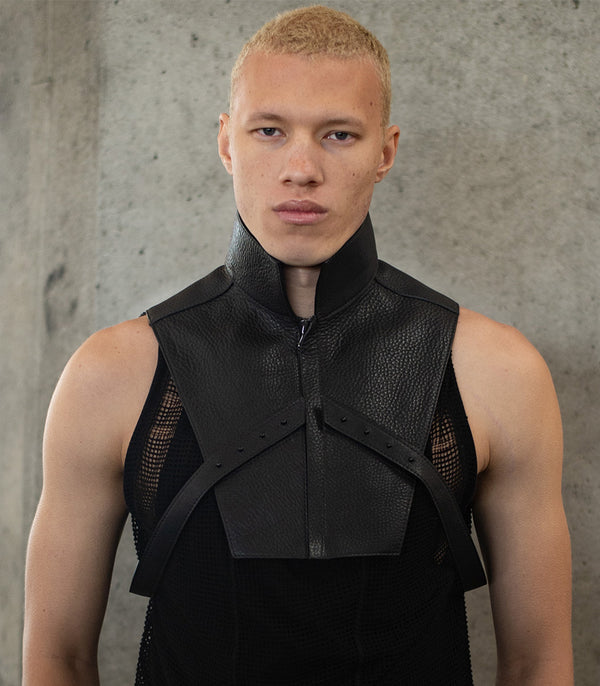 Front view Zip up high neck Leather vest harness on model featured in GQ magazine