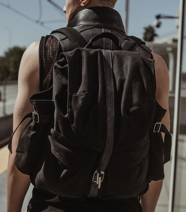 Model wearing X-large military cargo backpack with laptop holder from Badami and co